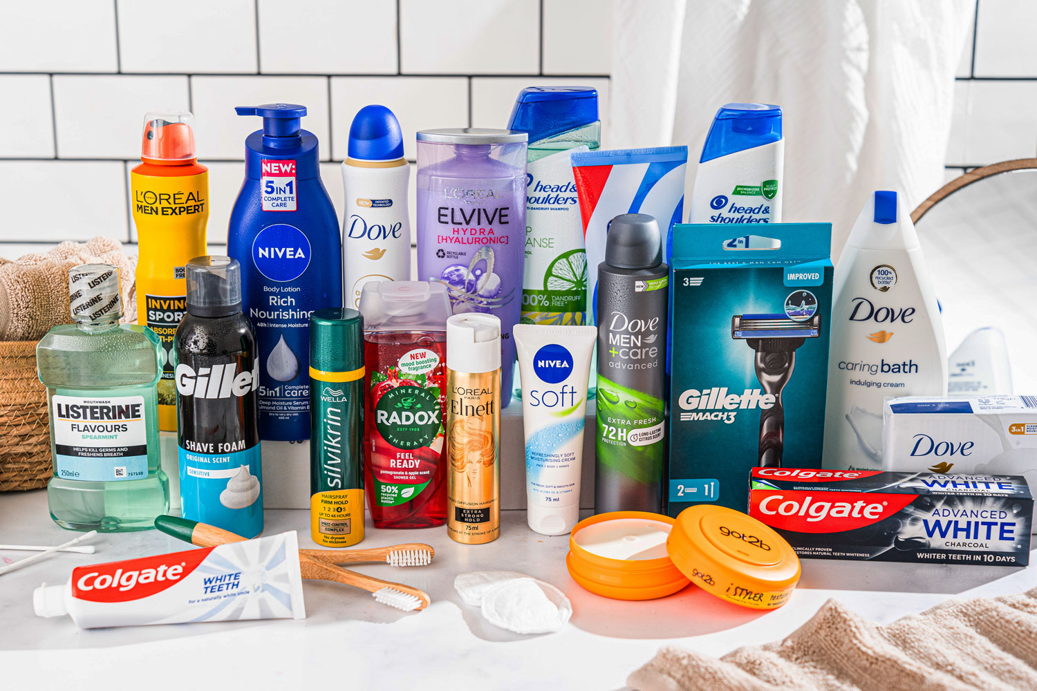 Assorted personal care products including mouthwash, shampoo, soap, and toothpaste